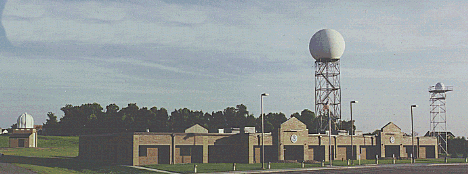 Building and surrounding radar towers