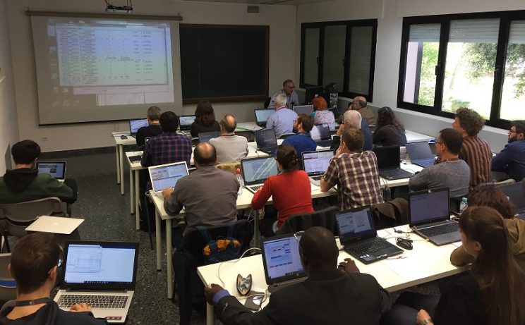 Classroom of students looking at data on large screen