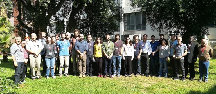 Participants standing outside the building