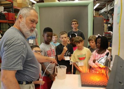 Kids watching lab experiment