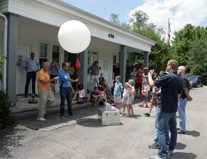 Holding a radiosonde (balloon) just before launch