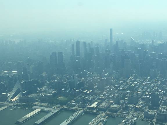 Research aircraft view of the city through the haze