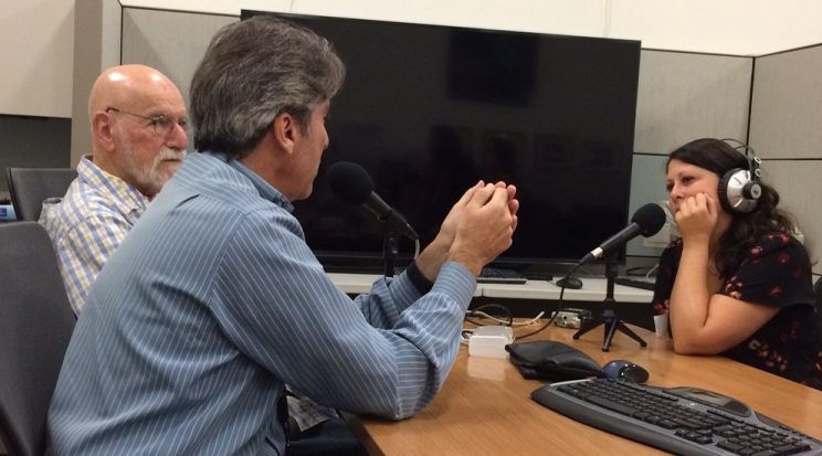 Stein, Heffter, and Lipuma sitting across from each other at a conference table with microphones