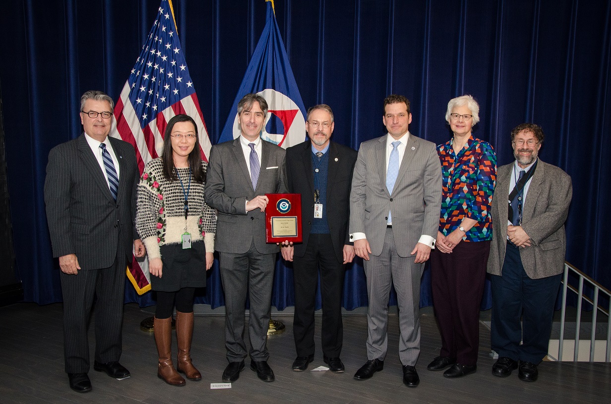 The five authors with their award, along with two senior NOAA managers.