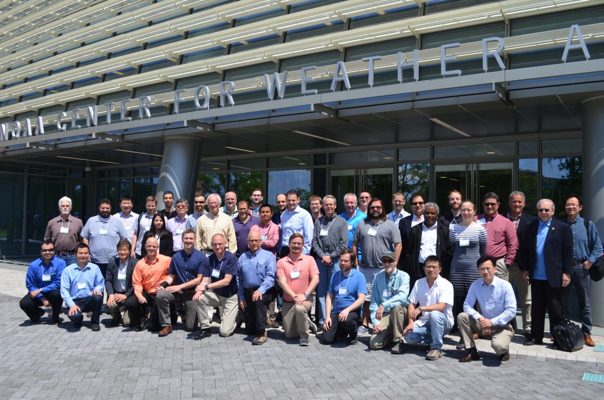 Group of 41 scientists in front of the entrance to NOAA's Center for Weather and Climate Prediction