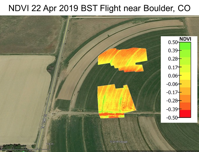 Aerial imagery of a mostly brown and green field with two yellow/orange areas taken 4/22/19 near Boulder, CO