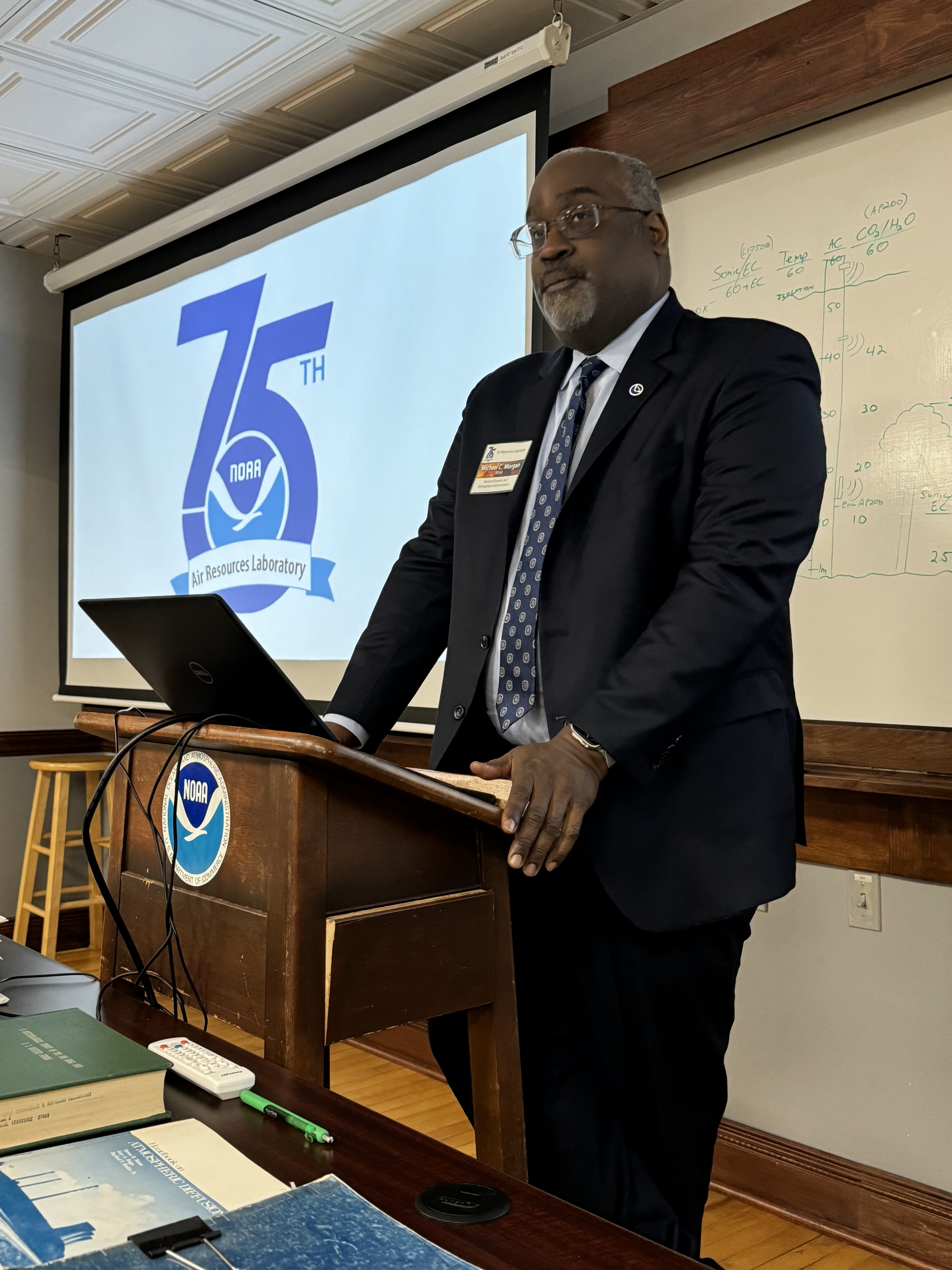 Man standing behind a podium