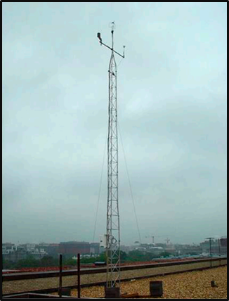 metal scaffold-like tower on top of a flat roof against an overcast sky and DC skyline.