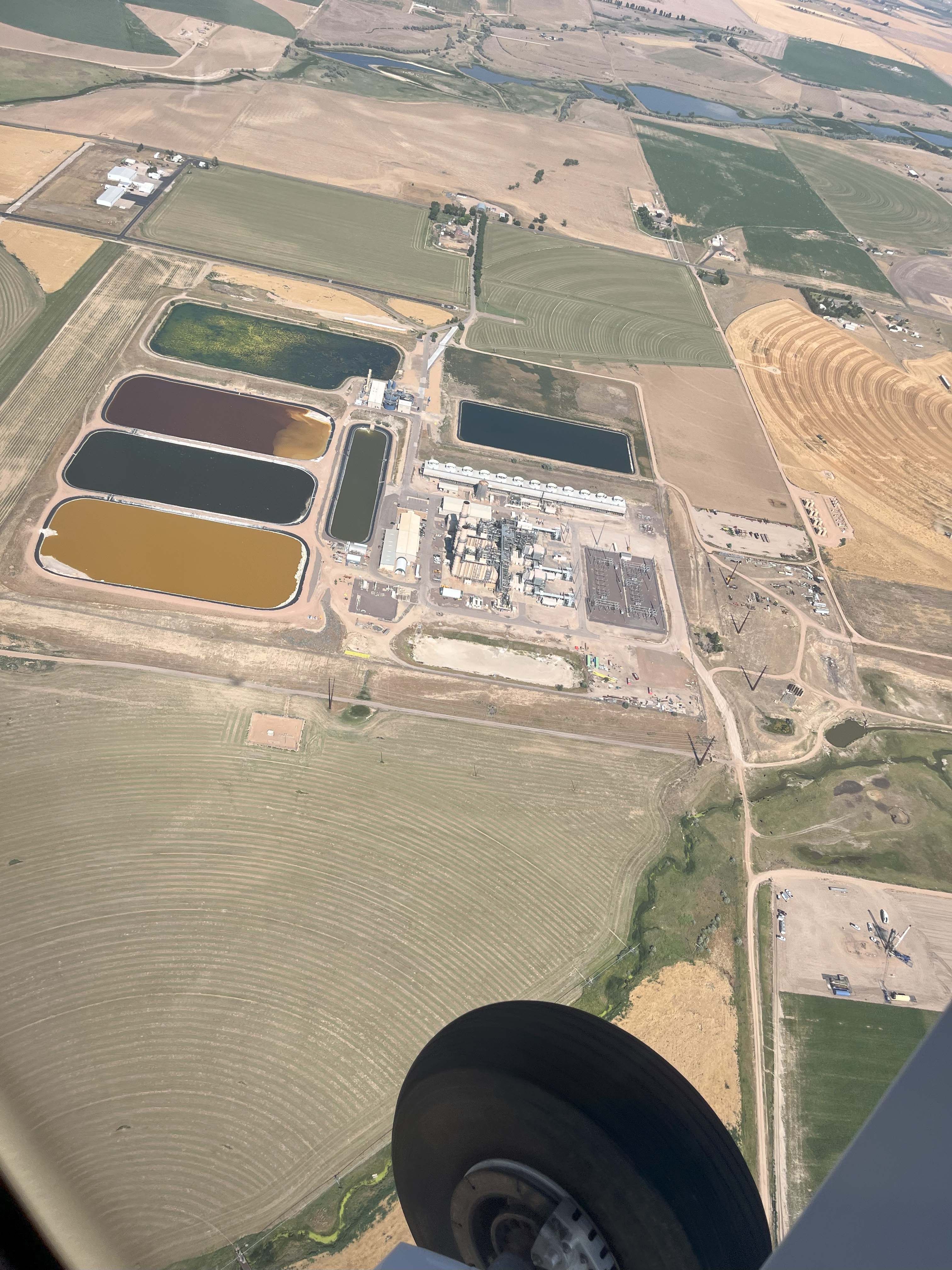 picture taken from inside a small plane of landfill below