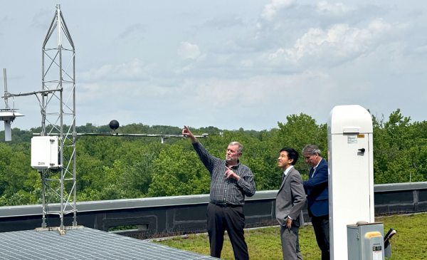Harold Diamond talks about the instruments on one of five UrbanNet towers in the DC Area. Credit: Tracey Bien-Aimé, NOAA/ORAU
