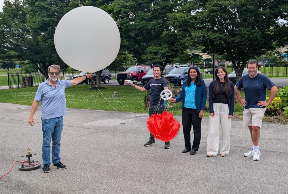 ATDD group posing with weather balloon (L-R) Tom Wood, Mauricio Toro, Praveena Krishnan, Quinn Adamy and Temple Lee posing with a weather balloon before launch. Credit: NOAA