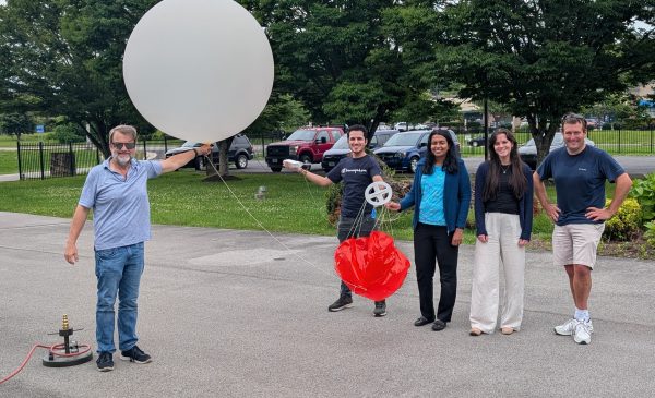 (L-R) Tom Wood, Mauricio Toro, Praveena Krishnan, Quinn Adamy and Temple Lee posing with a weather balloon before launch. Credit: NOAA